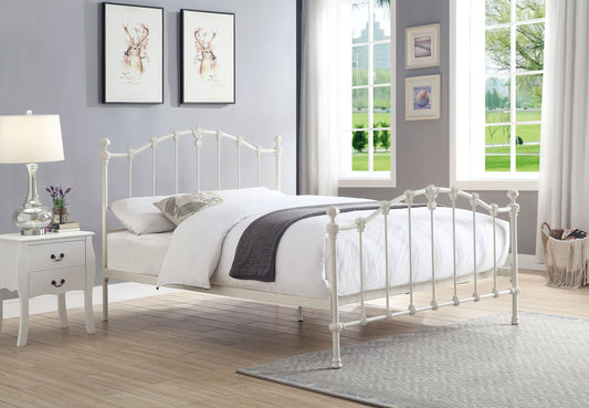 Traditional Claremont cast iron queen bed in Antique White, styled in a heritage bedroom interior